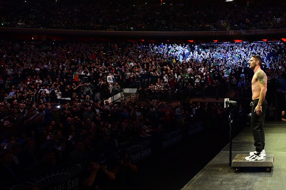  New York's Chris Weidman steps onto the scale in front of 15,480 fans at Madison Square Garden