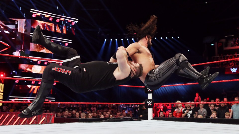  Seth Rollins hits a sling blade on Kevin Owens