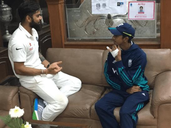  Indian captain Virat Kohli talks to Hameed