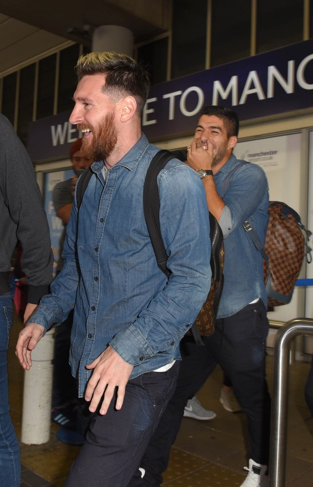  Messi grins as he arrives in England on Monday