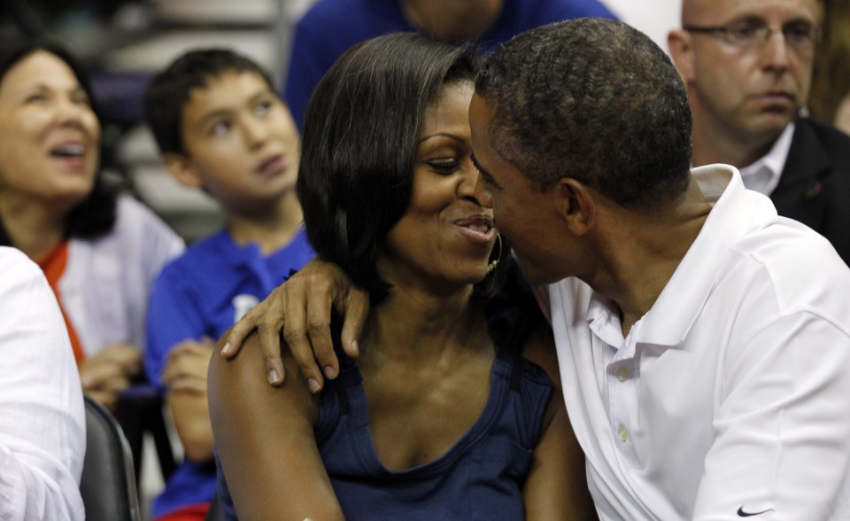  Obama and his wife Michelle pucker up for the Kiss Cam