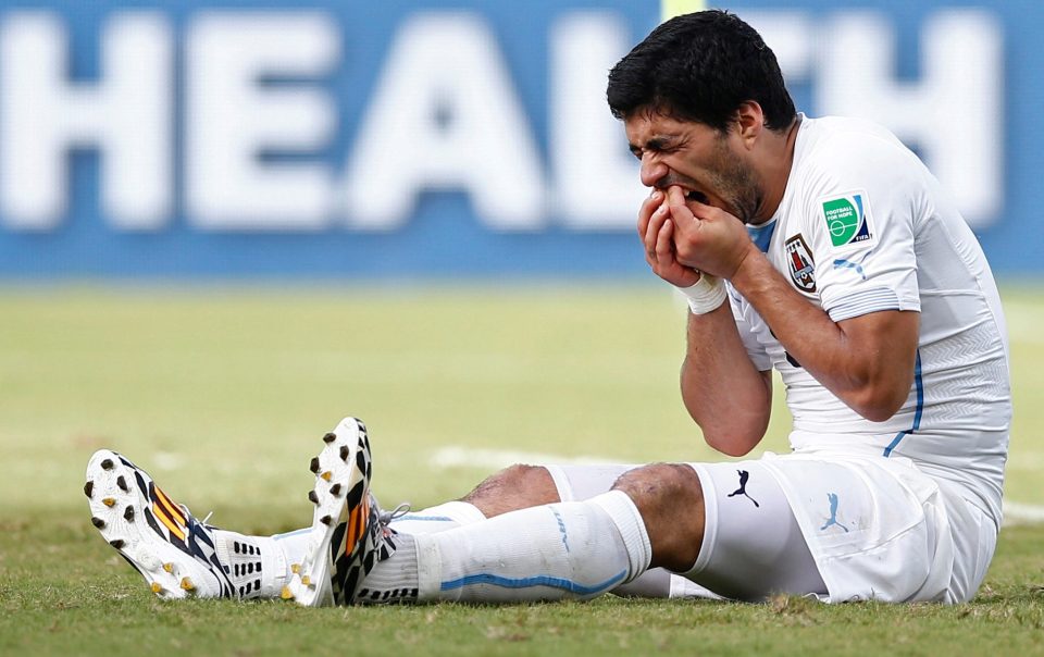  Suarez remained on the ground, checking over those infamous teeth, as Chiellini got up to try and show the referee what had just happened