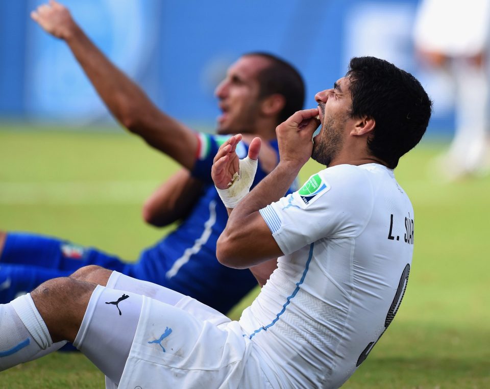  Incredibly, Suarez fell to the ground holding his teeth, as if he was the one who had been afflicted