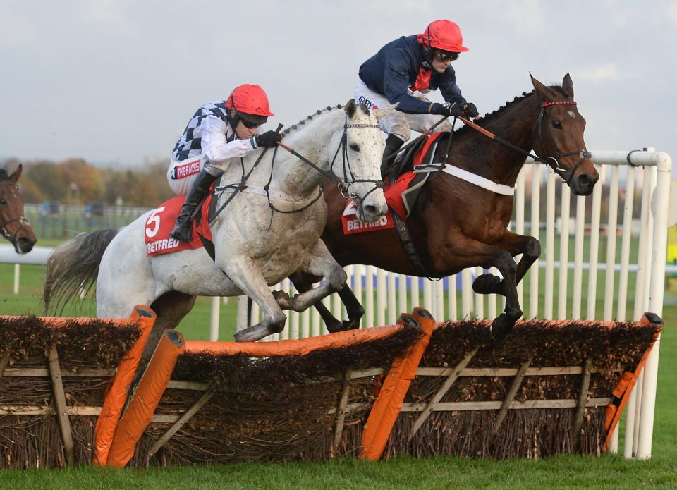  Simonsig ridden by Barry Geraghty (left) leaps clear in the Betfred Hurdle at Aintree