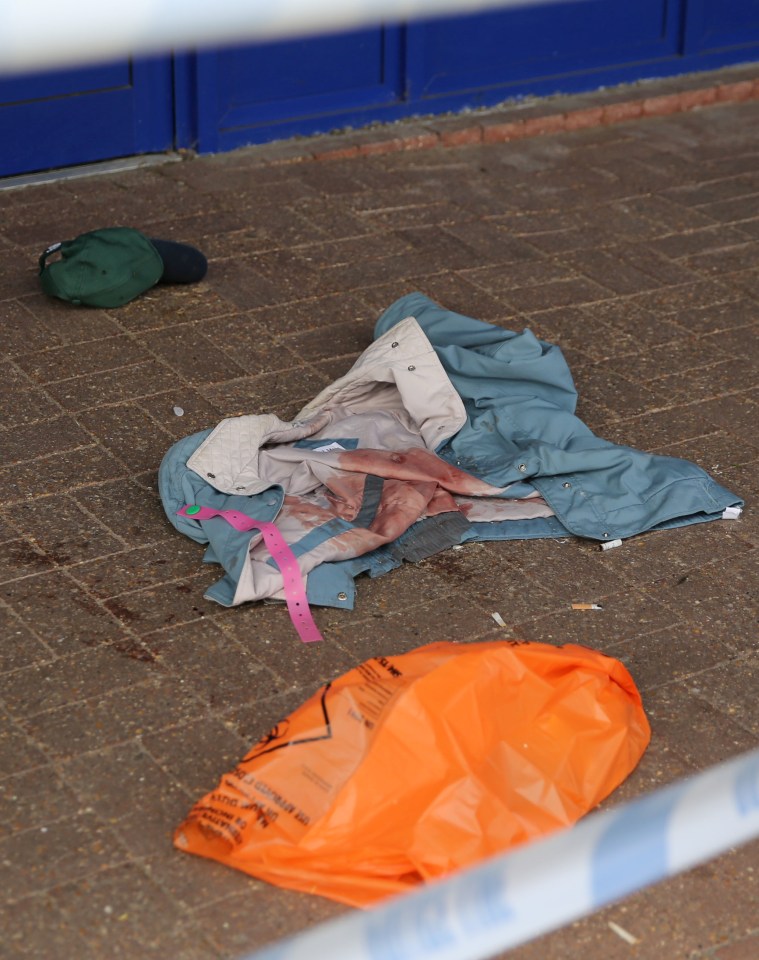  Blooded clothing could be seen at the store in the aftermath of the attack