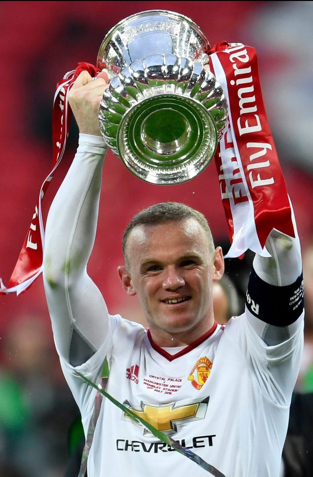  Wayne Rooney holds the trophy aloft after Manchester United beat Crystal Palace at Wembley in May