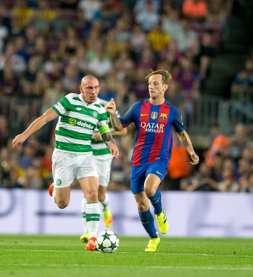  Scott Brown is chased down by Ivan Rakitic