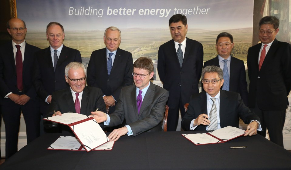  Greg Clark pictured signing energy plans at Hinkley Point