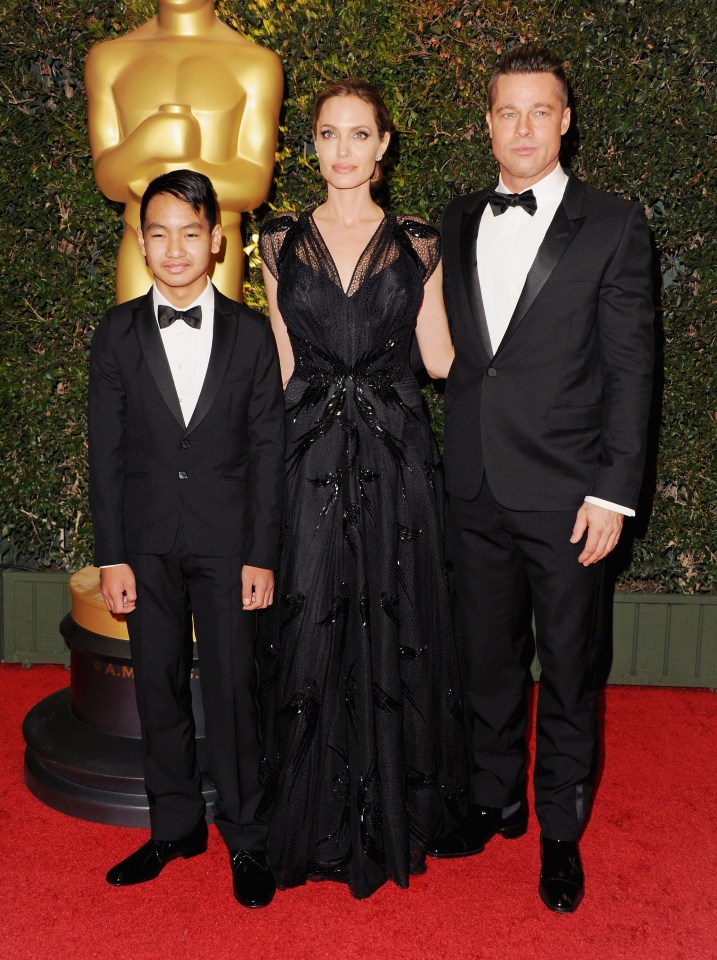  Maddox pictured on Oscars red carpet with parents Brad and Angelina