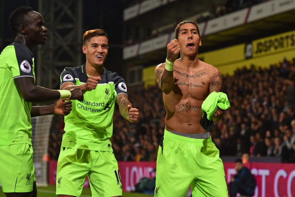  The two Brazilians Firmino and Coutinho celebrate Liverpool's fourth against Crystal Palace