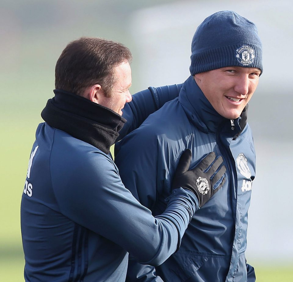  Wayne Rooney jokes around with Schweinsteiger in first-team training