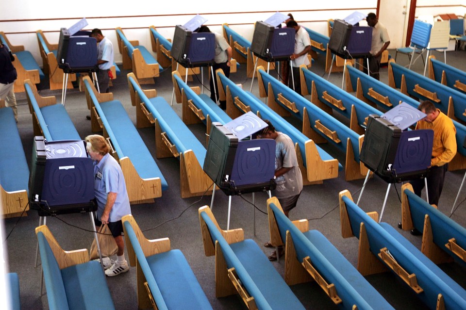  Voters in Miami, Florida cast their vote during the 2004 Presidential election