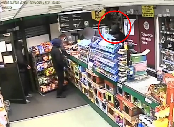  He holds the deadly weapon in front of the man's face before robbing the store