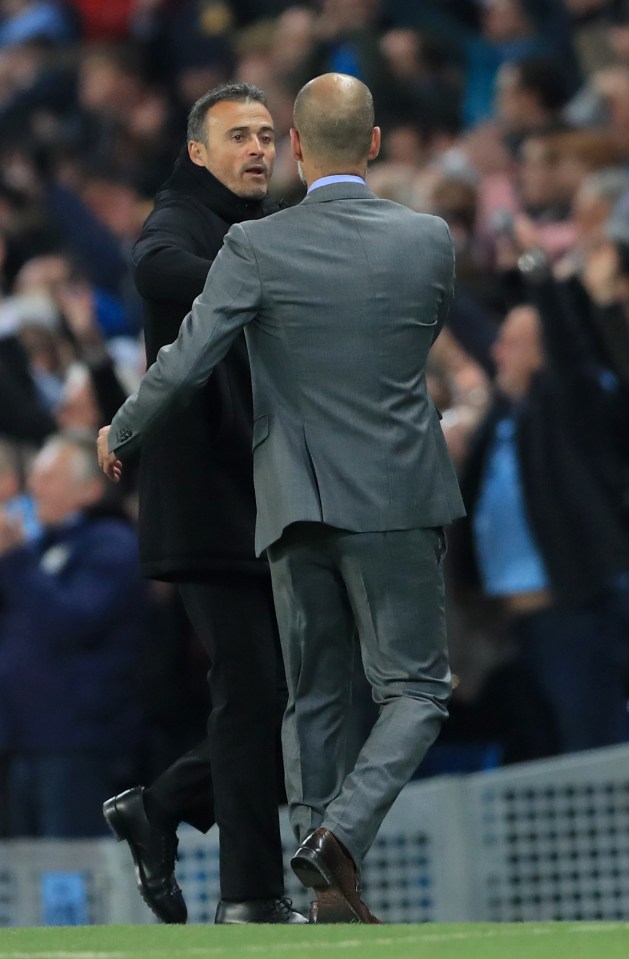 Barcelona manager Luis Enrique (left) and Manchester City manager Pep Guardiola embrace at the end of the game