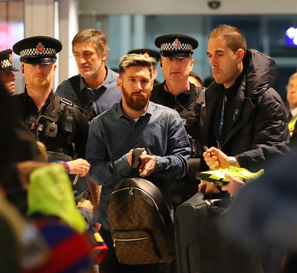  Lionel Messi gets a police escort at Manchester airport