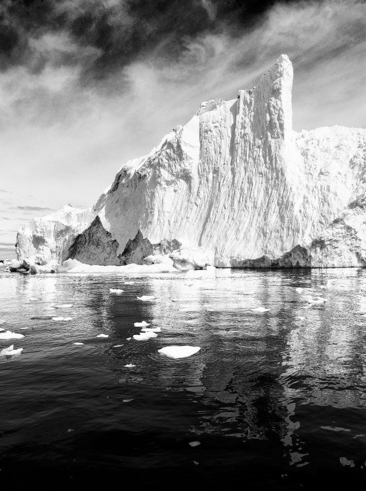  An iceberg towers above Cierva Harbor in the Western Antarctic Peninsula