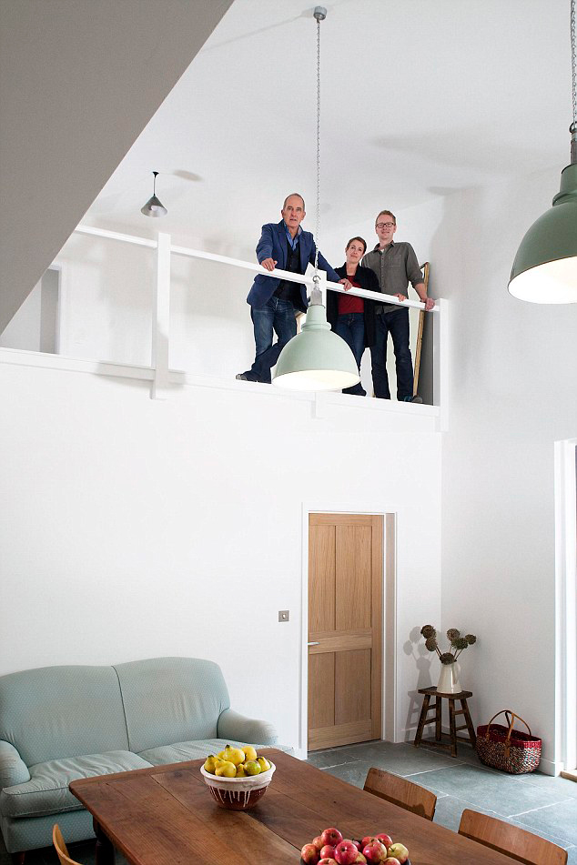  The couple and host Kevin McCloud look over the finished living area of the newly completed Devon house