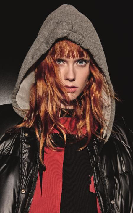  Kiki's fiery locks make it easy to pick the model out of advertising campaigns