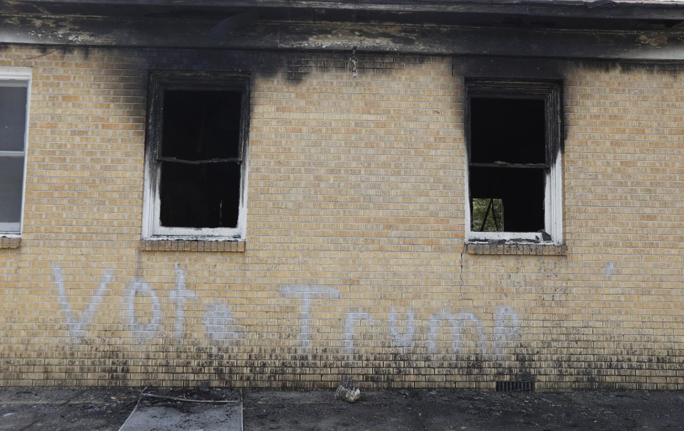  "Vote Trump" is spray painted on the side of the fire damaged Hopewell M.B. Baptist Church in Greenville, Missouri