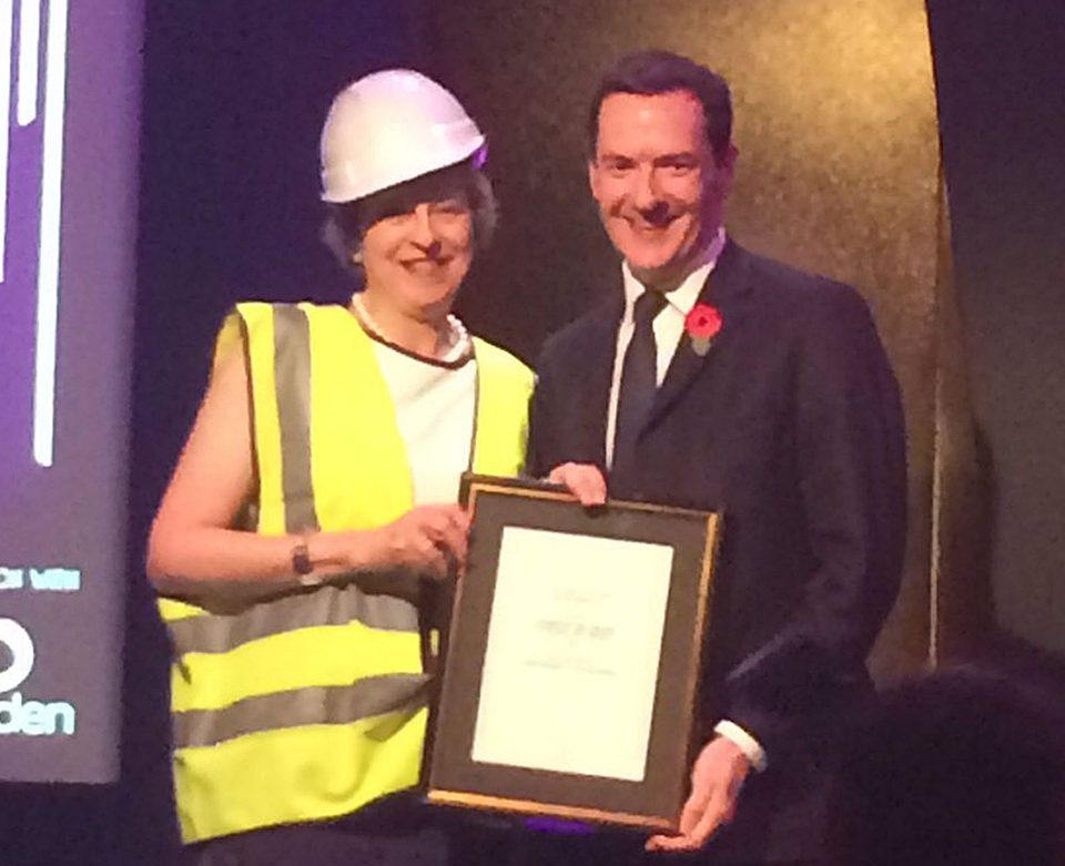  Theresa May wore a high-vis jacket as she accepted her award from George Osborne