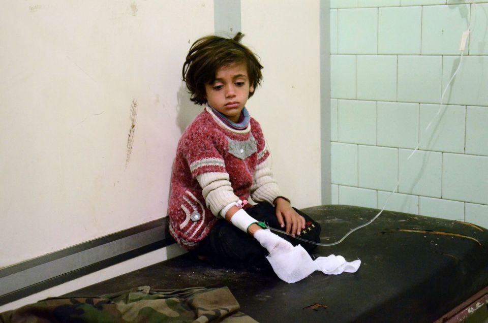  An injured child pictured at a hospital in Aleppo. The Syrian refugee crisis has divided America