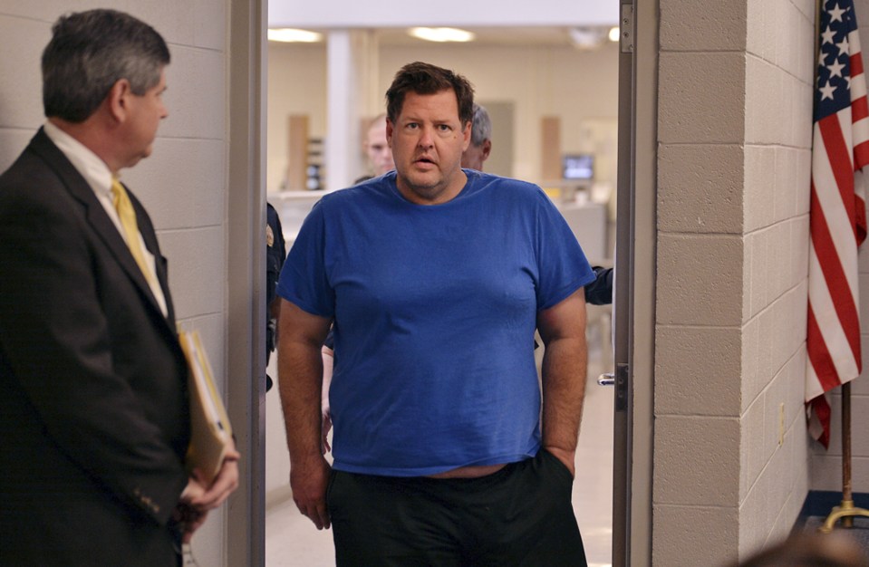  Todd Kohlhepp is escorted into a Spartanburg County magistrate courtroom after being accused of a string of murders