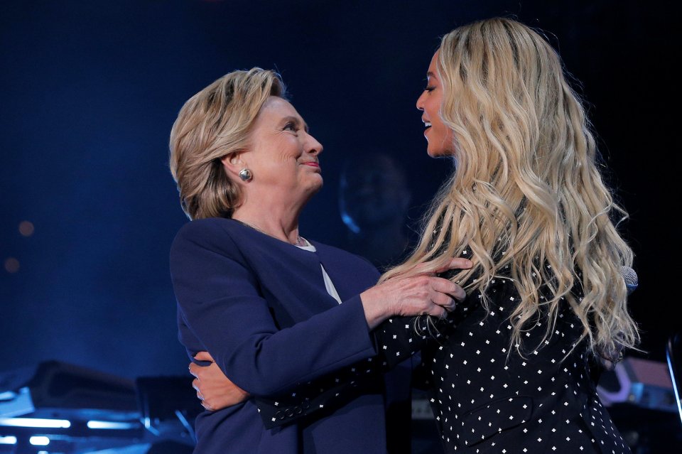  Beyonce and Hillary Clinton embrace on stage - the singer urged voters to give the democratic candidate their support