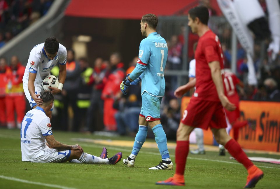 Football Soccer - Bayern Munich v TSG Hoffenheim - German Bundesliga - Allianz-Arena, Munich, Germany - 05/11/16 - TSG Hoffenheim Steven Zuber is comforted by Benjamin Huebner after his own goal against Bayern Munich. REUTERS/Michael Dalder DFL RULES TO LIMIT THE ONLINE USAGE DURING MATCH TIME TO 15 PICTURES PER GAME. IMAGE SEQUENCES TO SIMULATE VIDEO IS NOT ALLOWED AT ANY TIME. FOR FURTHER QUERIES PLEASE CONTACT DFL DIRECTLY AT + 49 69 650050