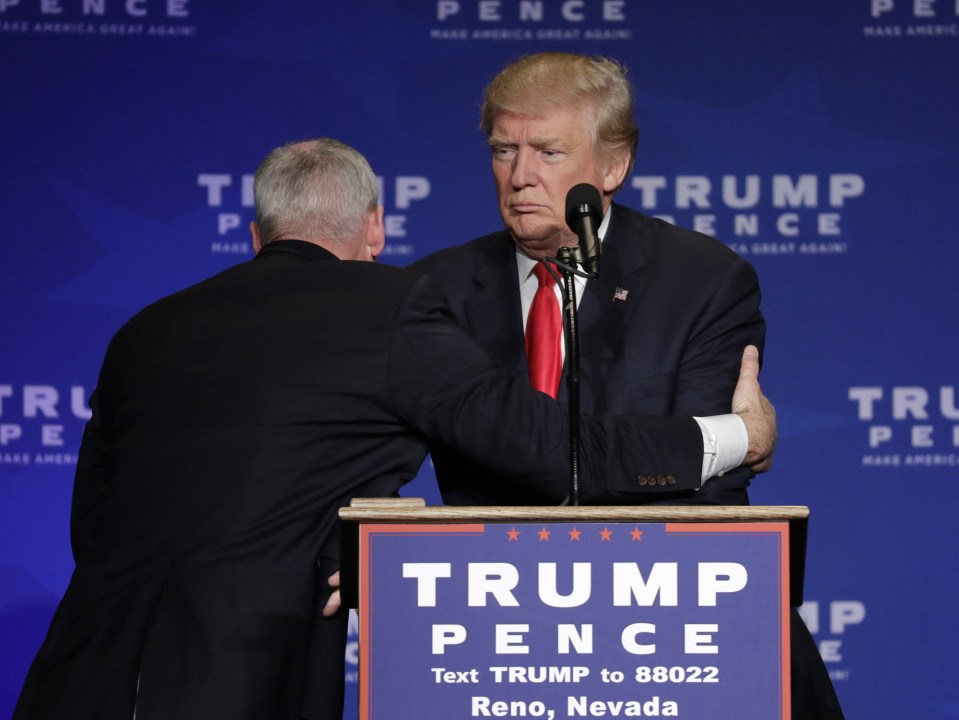  Donald Trump being hauled off stage at a rally in Nevada last week