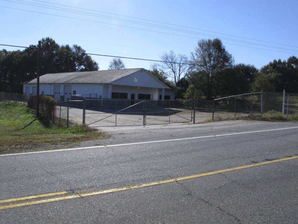  The building that once housed the Superbike Motorsports shop was filled with police after the 2003 massacre