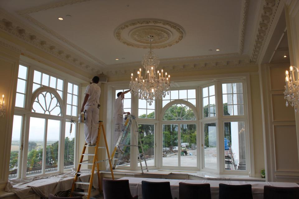  Decorators work in a dining room at the hotel of the Trump Turnberry golf resort