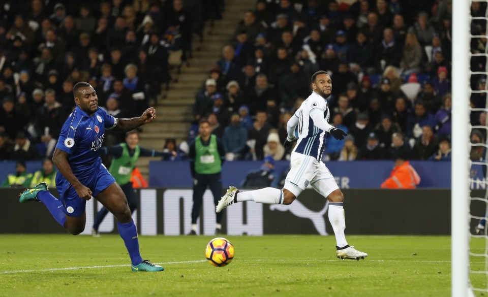  Matty Phillips dinks the ball into the goal as the despairing Wes Morgan watches on