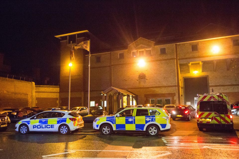  Dozens of police cars surrounded the prison in Bedfordshire as the riot continued inside