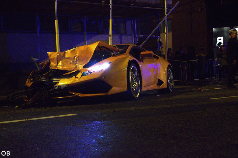  Pricey prang... The Lamborghini after a crash in Manchester city centre