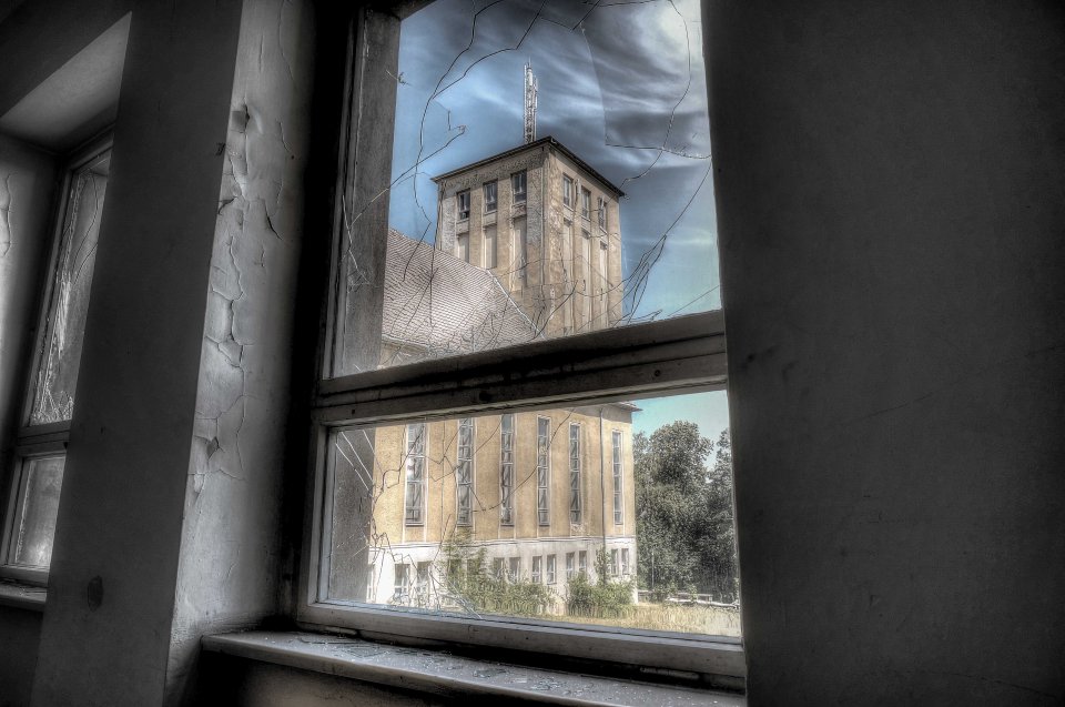  The tower of the Nazi designed school can be seen through the window