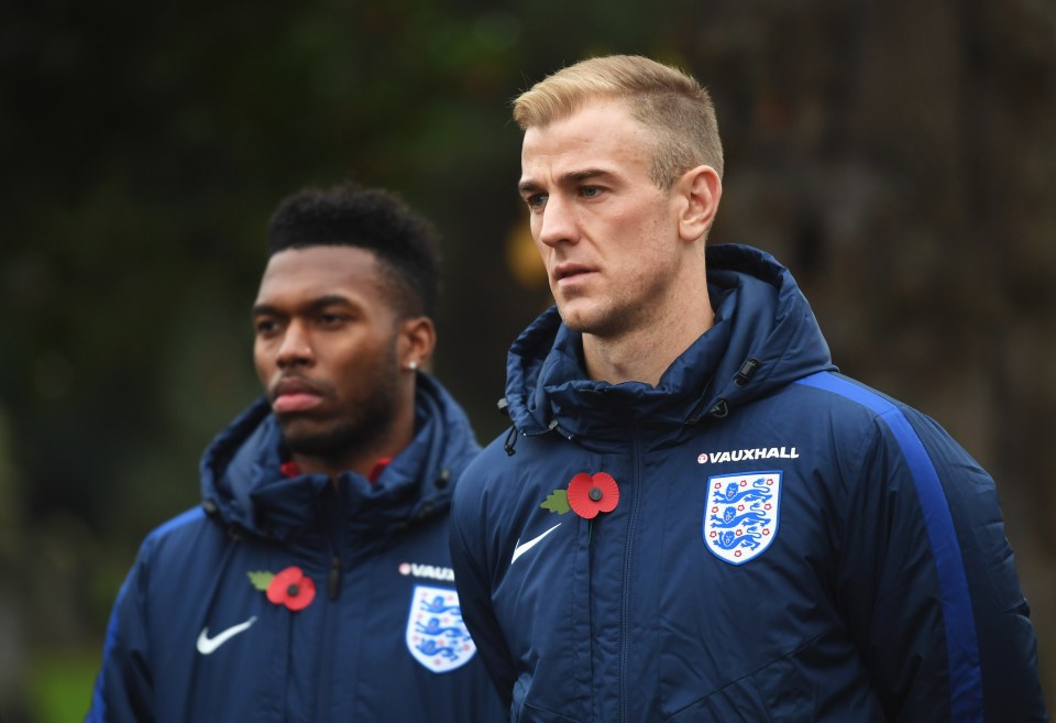  England's Daniel Sturridge and Joe Hart look on solemnly during the ceremony