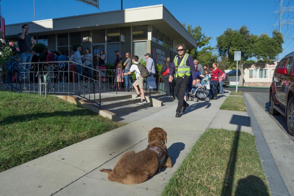  Residents of Burbank, California, queue outside a church to cast their votes