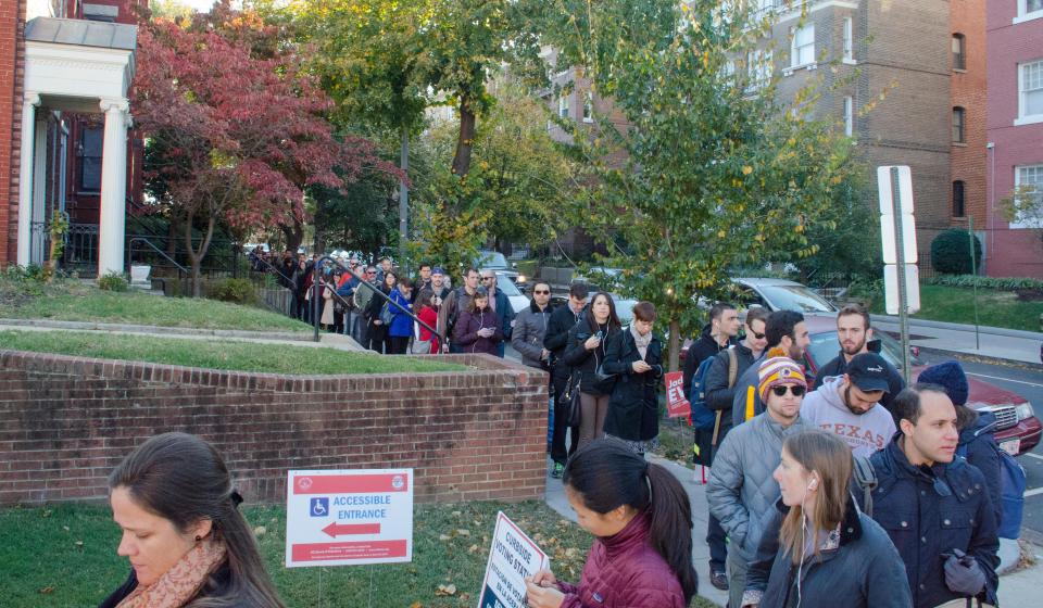 Americans wait in line to vote in Washington DC