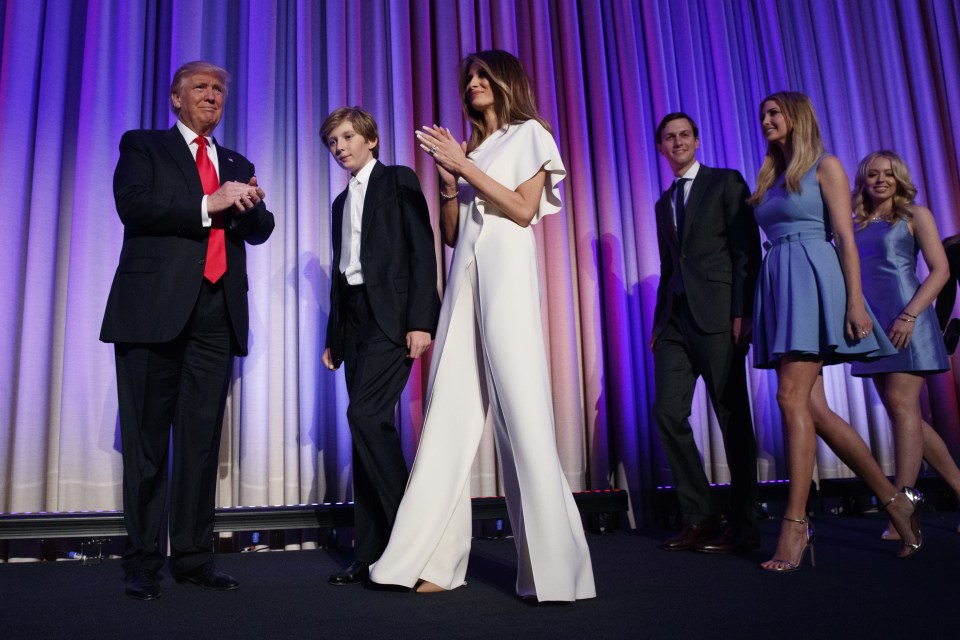  Donald Trump and his family, including wife Melania in white, arrive as he prepares to speak at an election night rally on Wednesday in New York