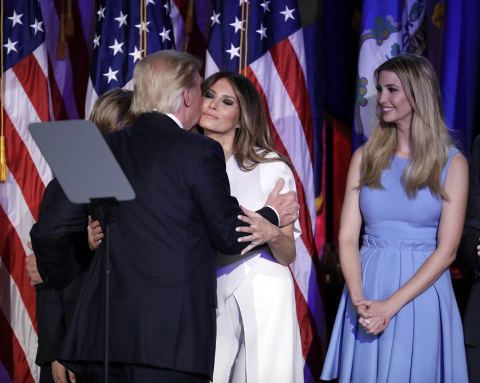  Trump kissed his wife Melania as his daughter Ivanka looked on following his election as US President. Trump and Melania's son Barron looked on