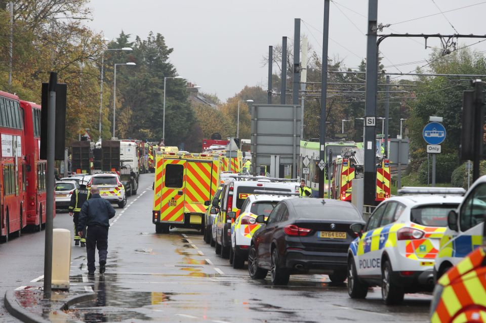  Emergency services at the scene in Croydon where the tram overturned as it took a sharp bend near an underpass