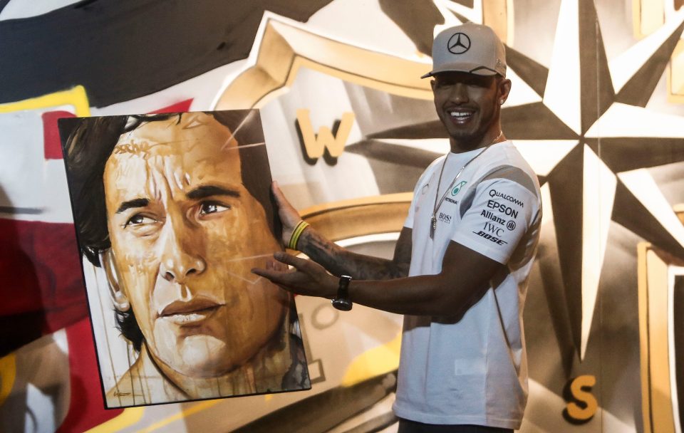  Lewis Hamilton receives a portrait of late Brazilian driver Ayrton Senna