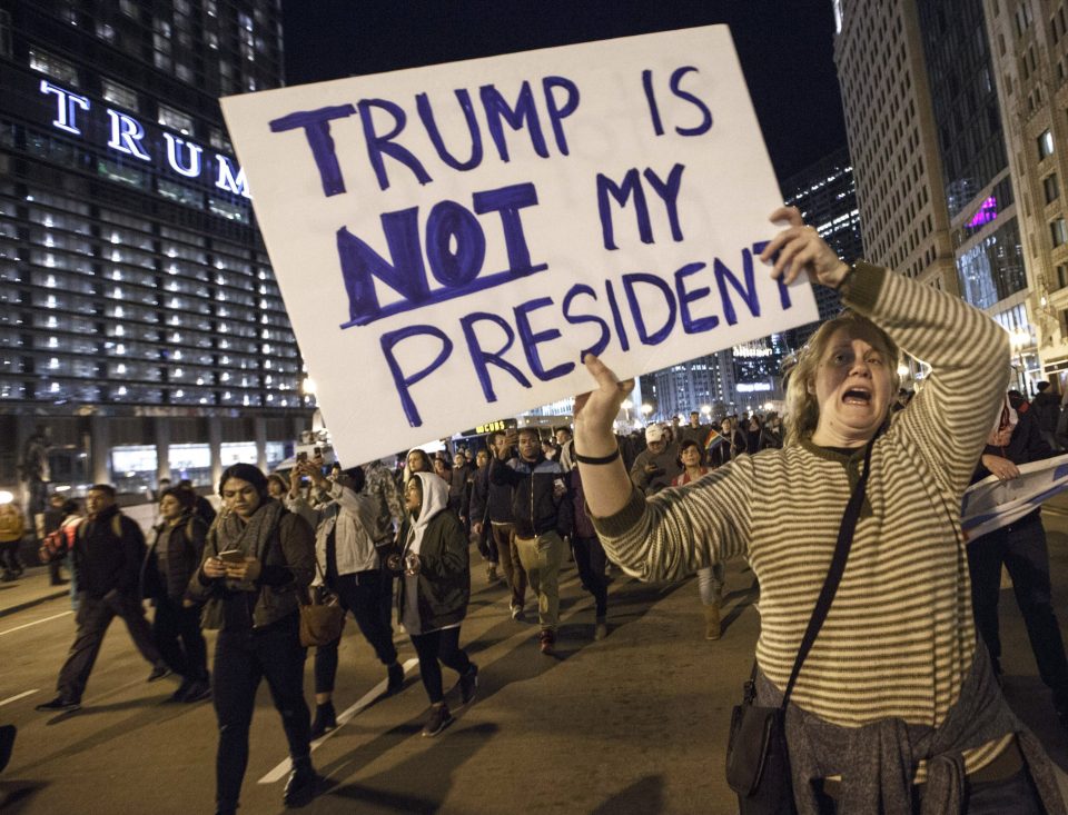  Demonstrators protest outside the Trump Tower in Chicago, Illinois