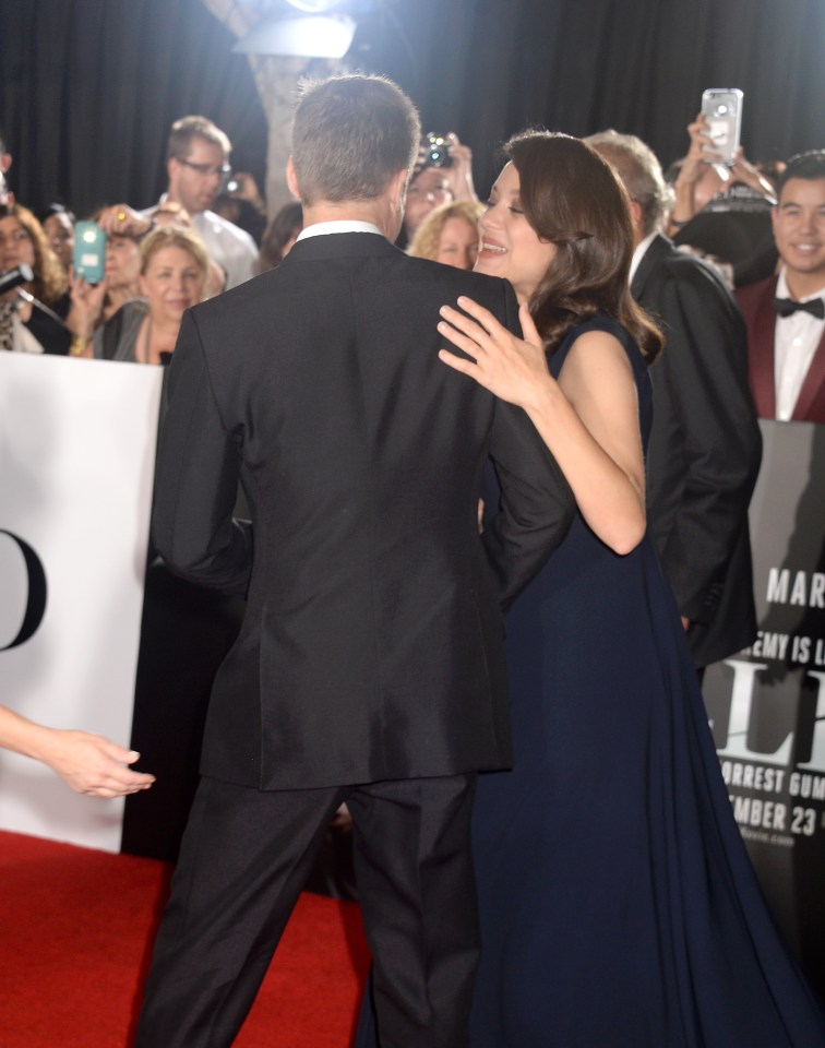  Brad and Marion looked relaxed as they walked the red carpet together