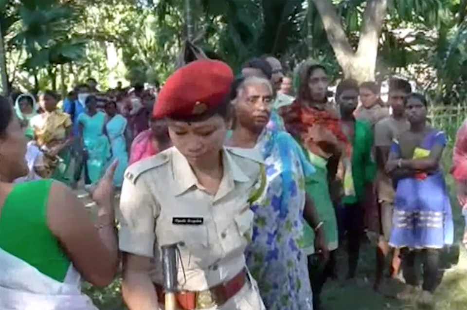  Police in the jungle with villagers who are well used to sorcery