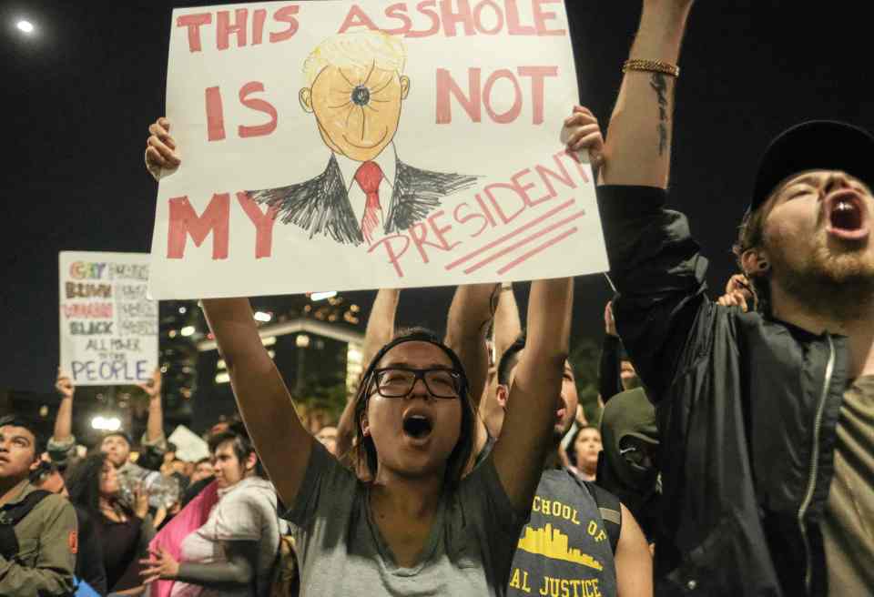  An anti-Trump demonstrator in Los Angeles, California, earlier this week making fun of the new President