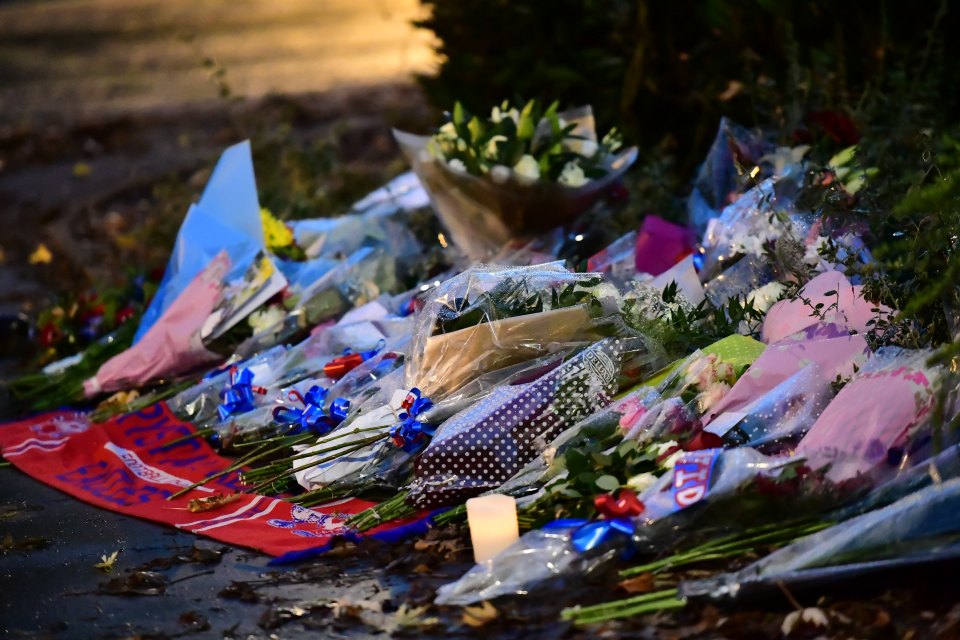  Flowers have been laid at the scene for the seven victims