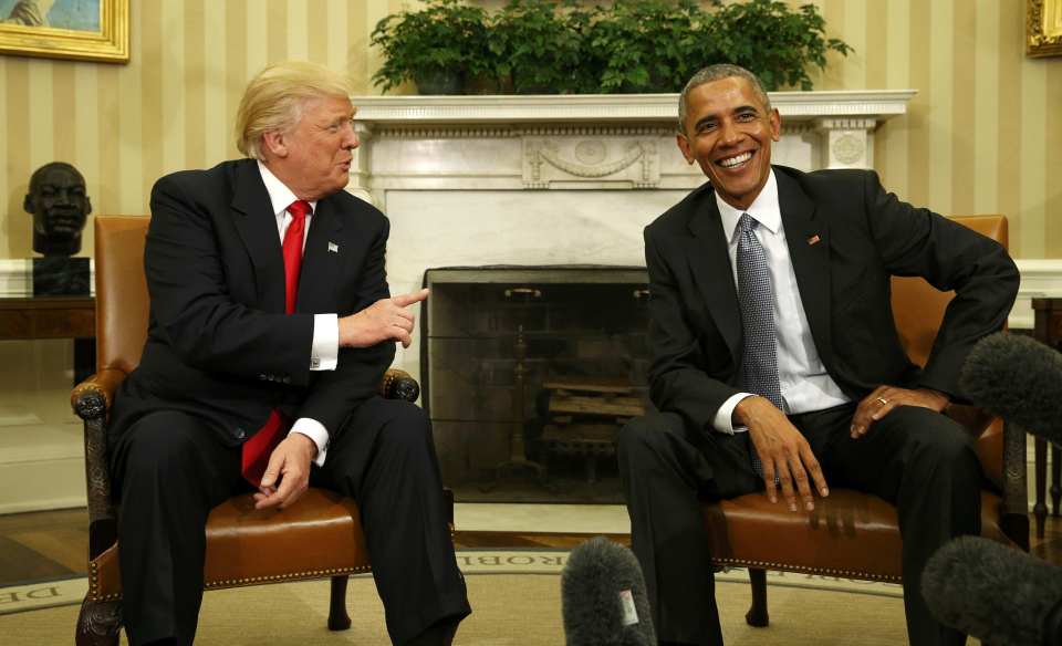  You're fired....the brash billionaire points his finger at Obama as the two share a laugh