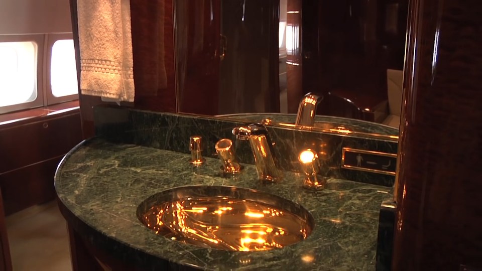  Gold plated master bathroom features marble worktops and a shower