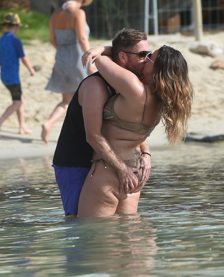  The couple could barely keep their hands off each other in the water